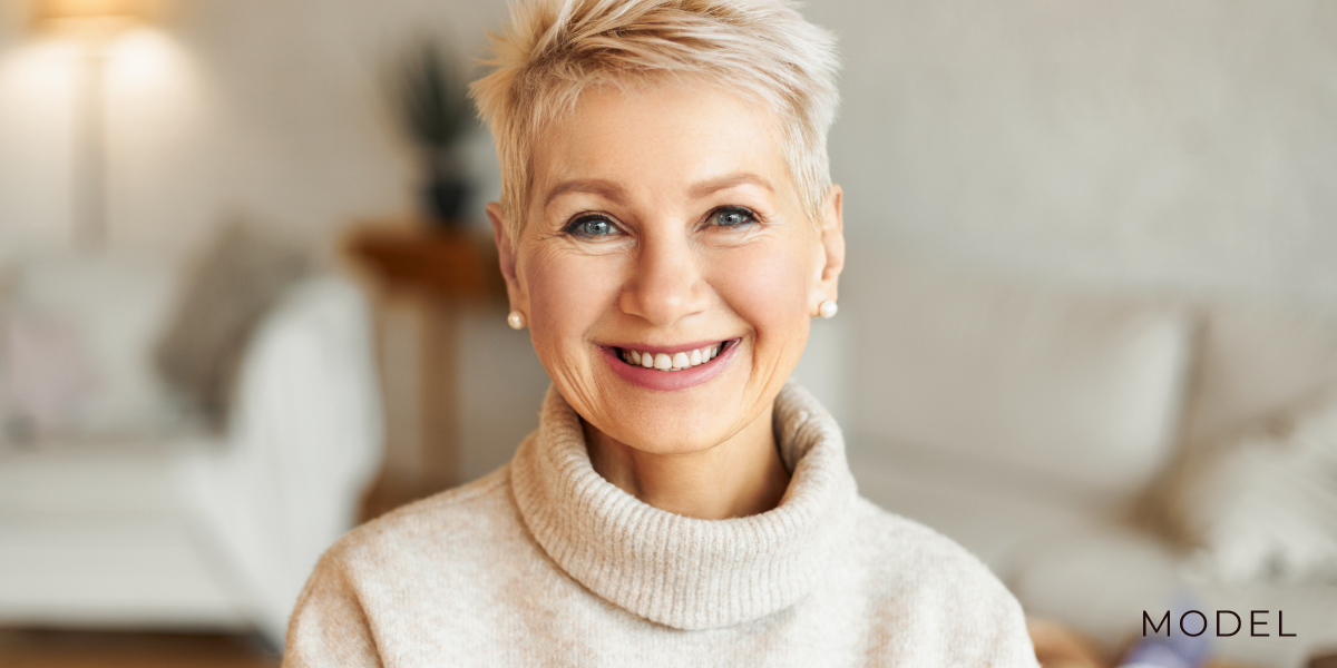 Older Woman in White Room Smiling